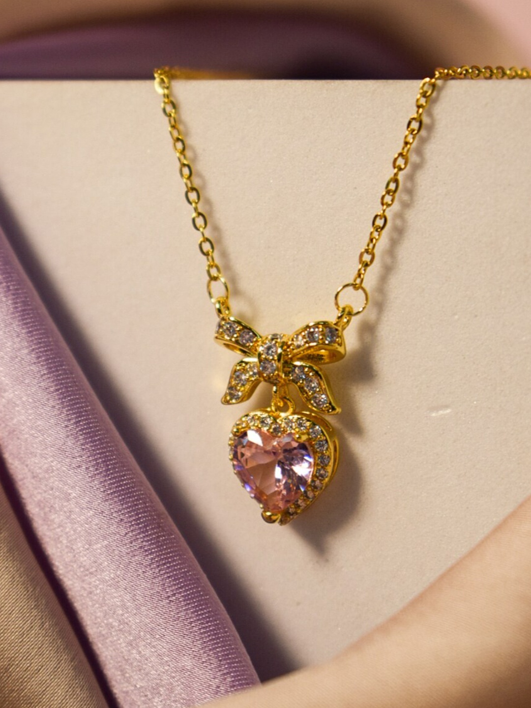 

DressBerry Gold-Toned & Pink Stone-Studded Bow Necklace