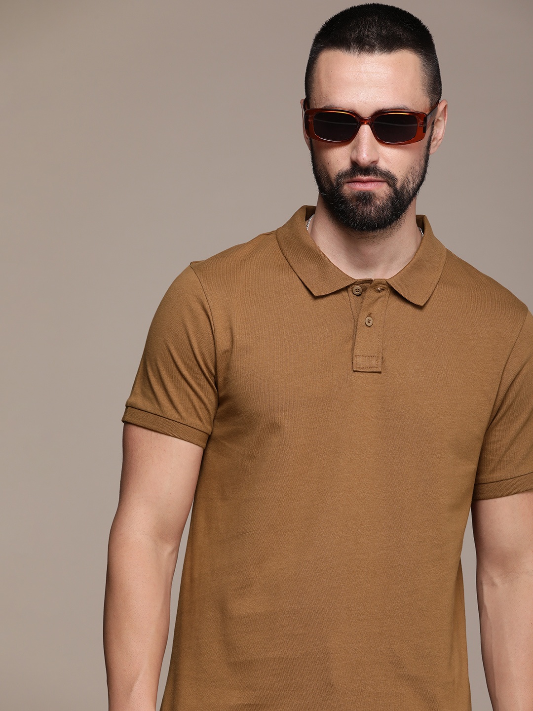 

Roadster Men Solid Polo Collar Regular Fit T-shirt, Brown