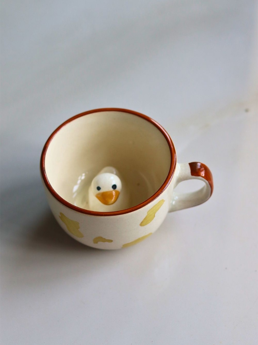 WEAVING HOMES Beige & Yellow Printed Ceramic Glossy Duck Mug 200 ml