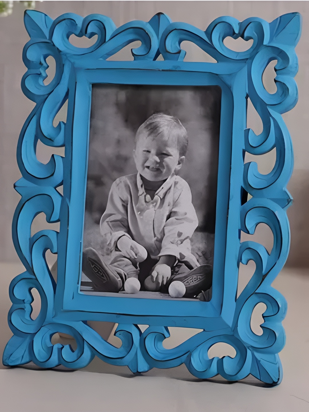 

Duadecor Blue Self Design Wooden Table Photo Frame