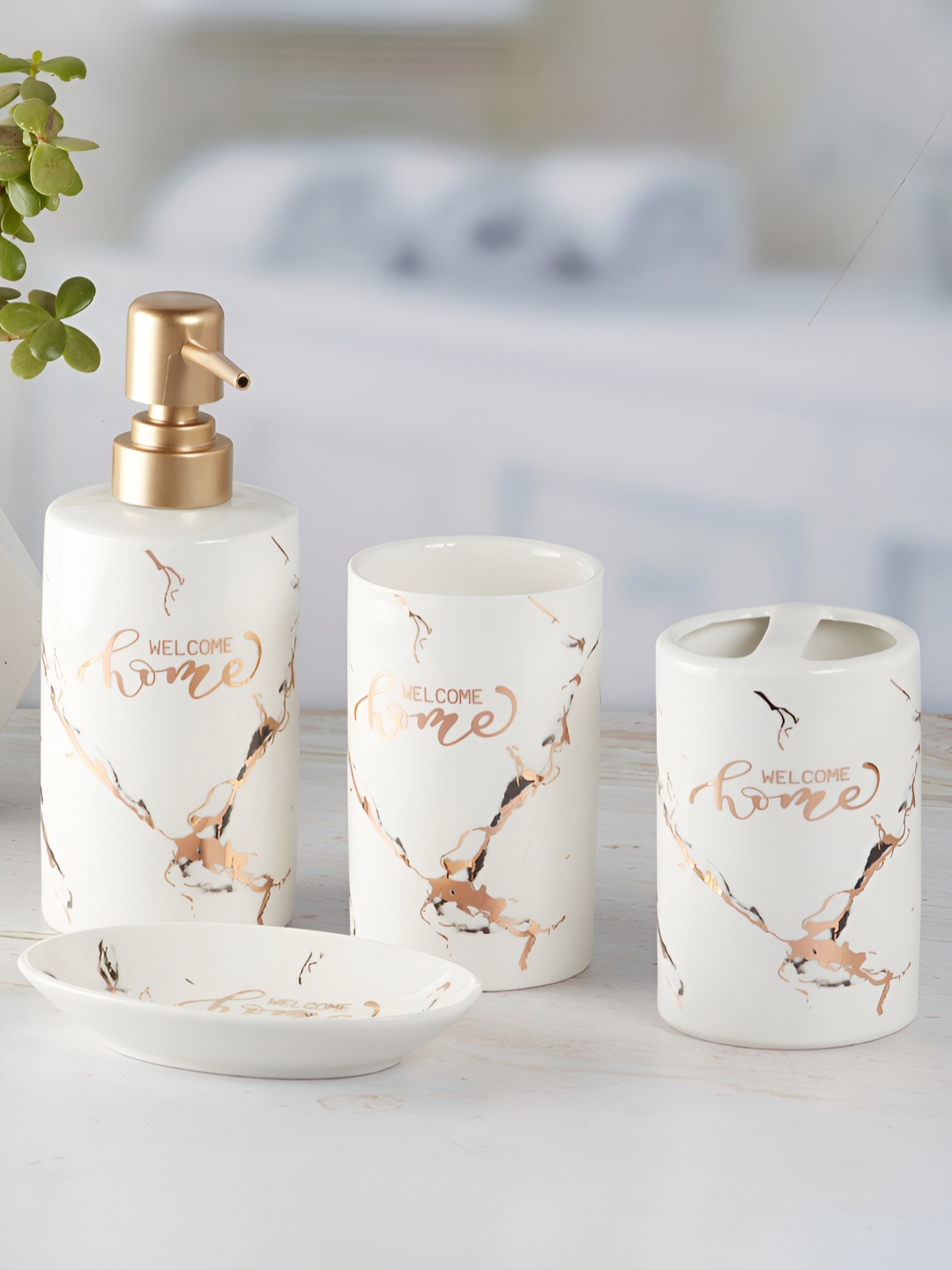 

Kookee White & Gold Toned 4 Pieces Ceramic Abstract Bath Accessories Set