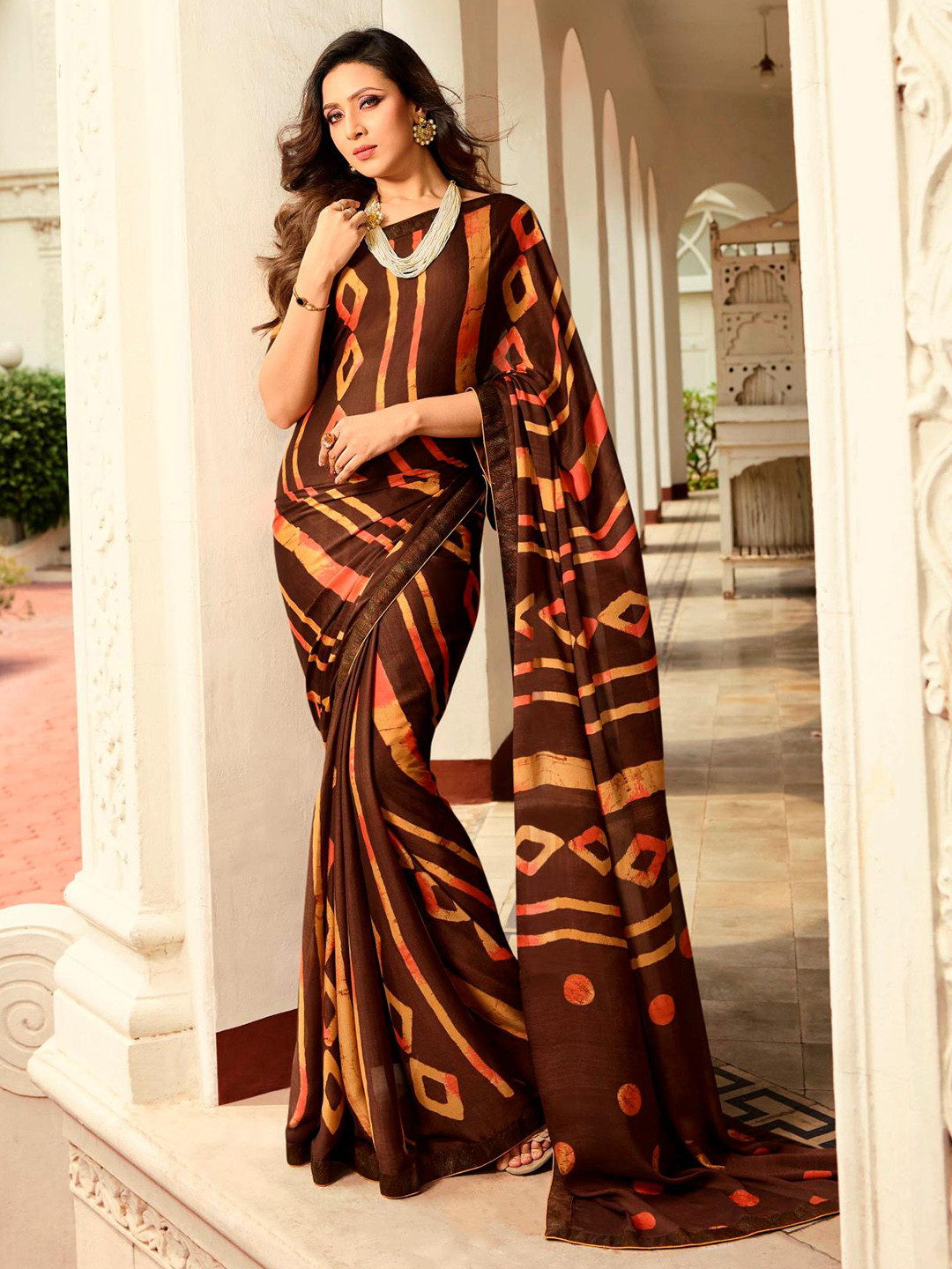 

Civamee Brown Floral Poly Georgette Designer Saree
