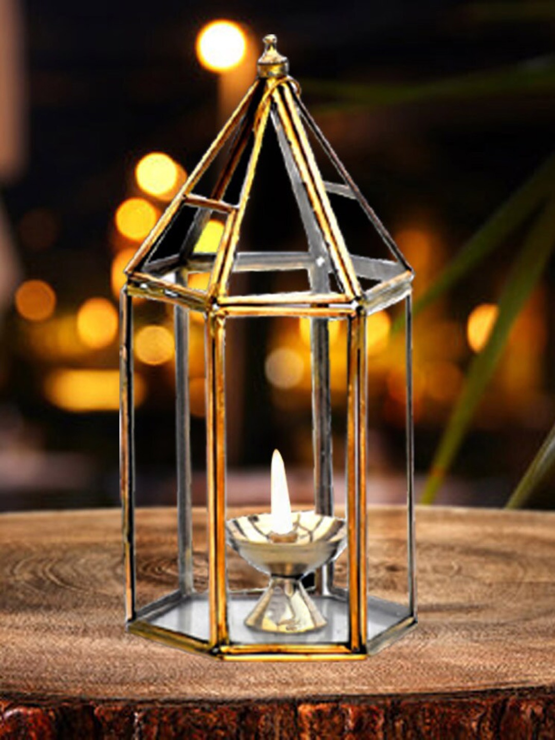 

DSH Crafting Your Curiosity Metallic toned & Transparent Glass Lantern with Brass Diya, Gold