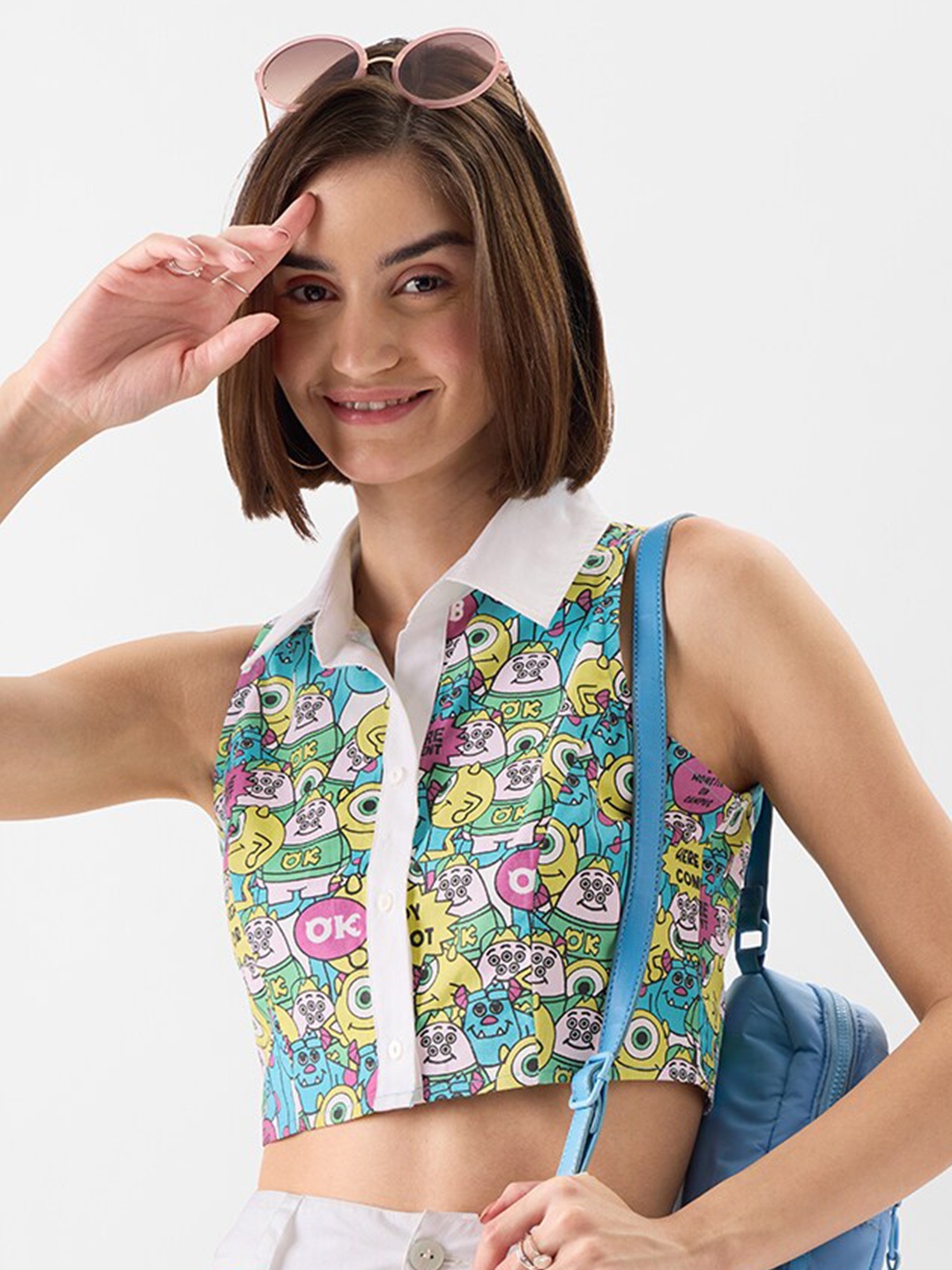 

The Souled Store Blue Monsters Inc: Hide & Seek Print Sleeveless Cotton Casual Crop Shirt