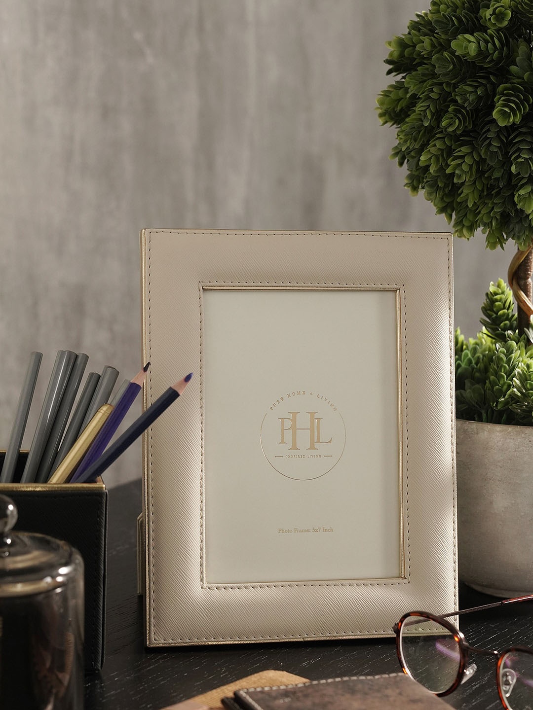 

Pure Home and Living Beige & Gold Toned Self Design Faux Leather Table Photo Frame
