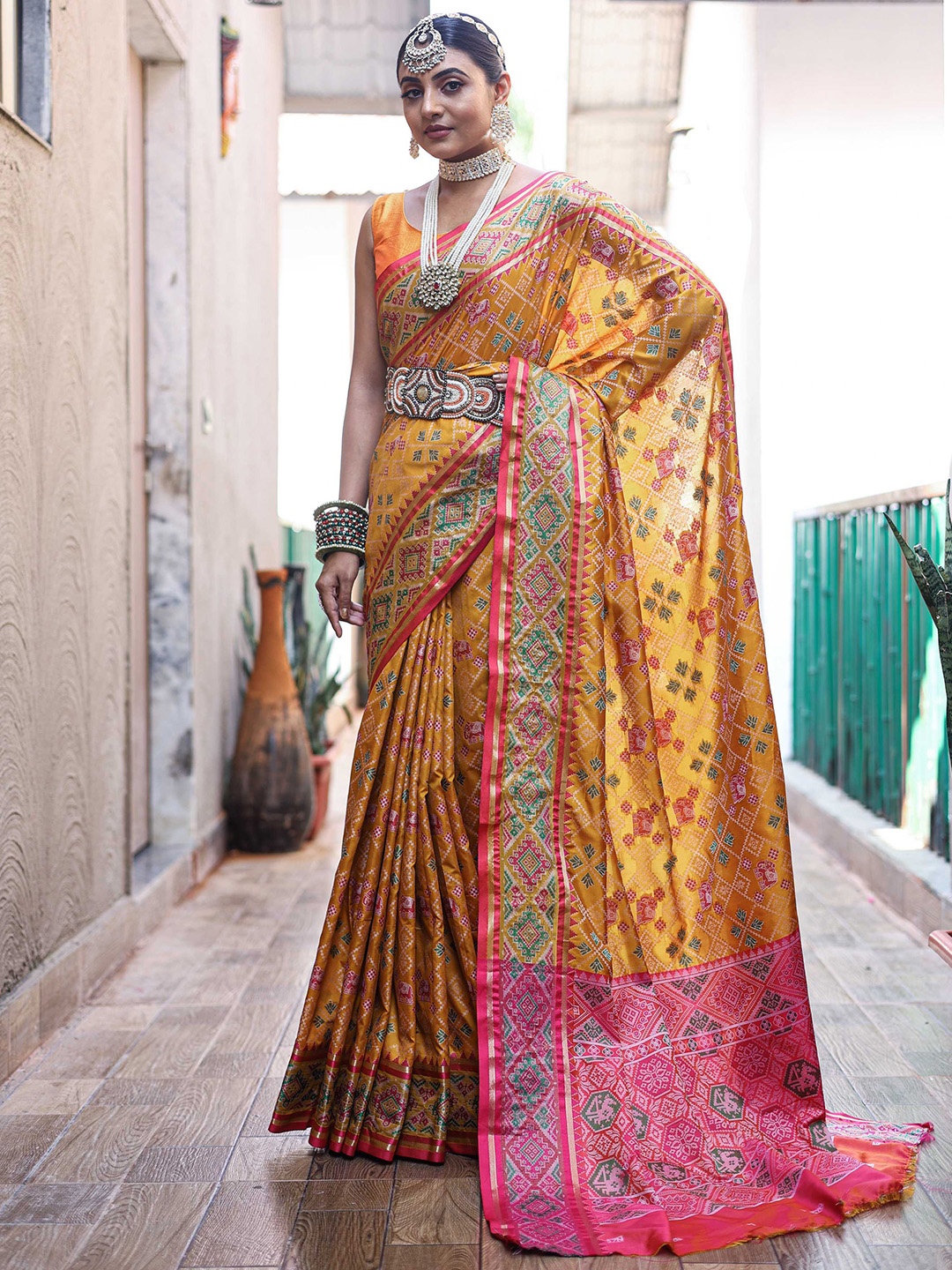 

Mitera Mustard Yellow Ethnic Motifs Woven Design Zari Patola Saree