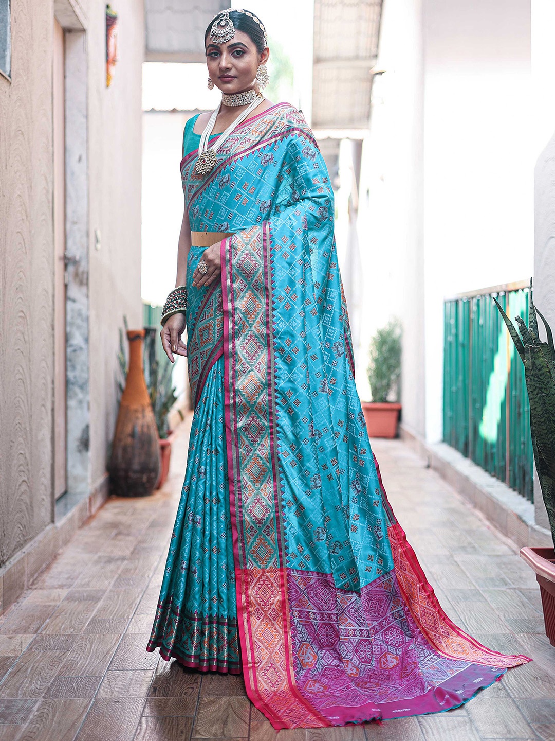 

Mitera Blue Ethnic Motifs Woven Design Zari Patola Saree