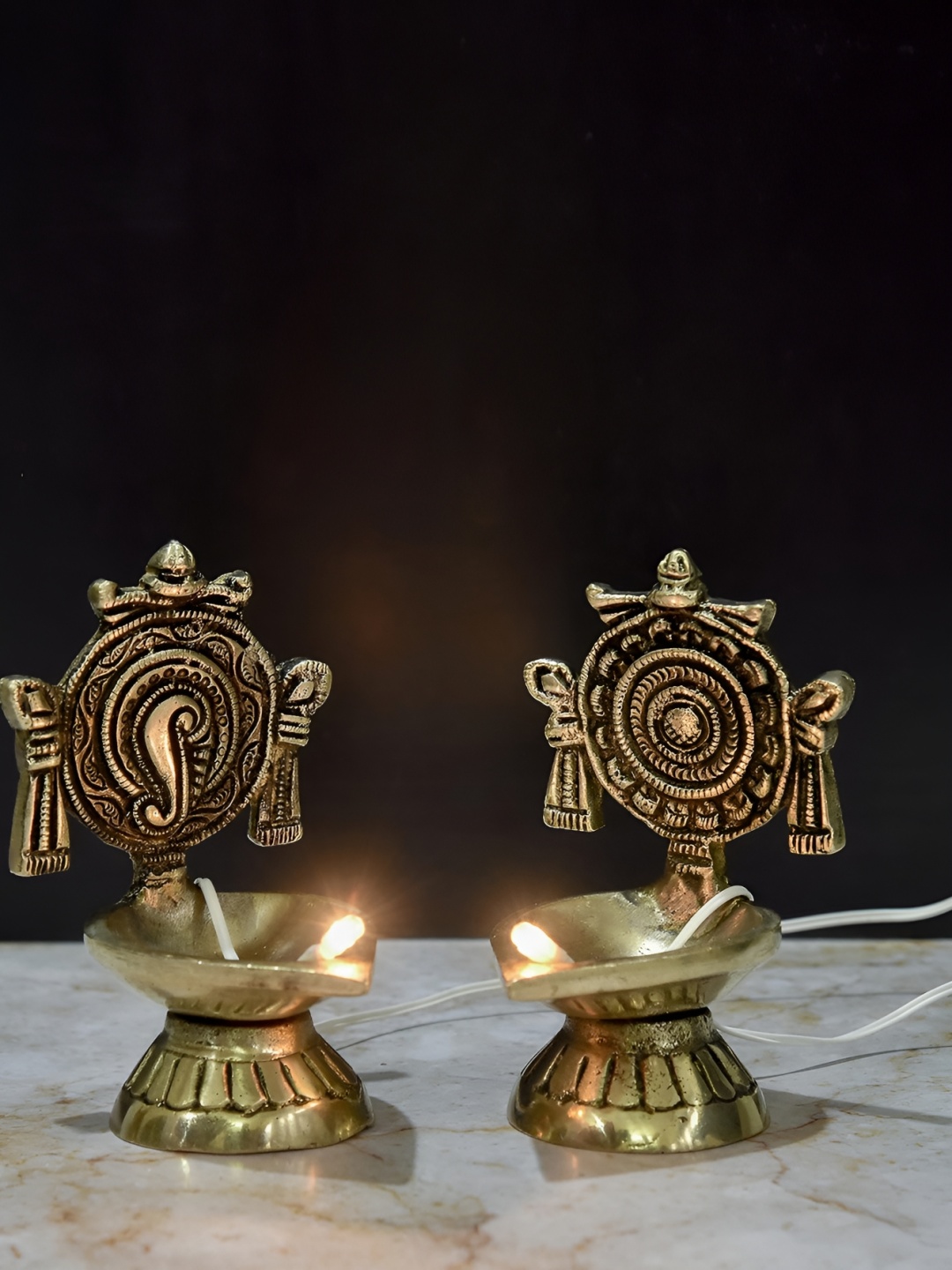 

Bhimonee Decor Gold-Toned 2 Pcs Shanku Chakra Design Brass LED Light Electric Pooja Diyas