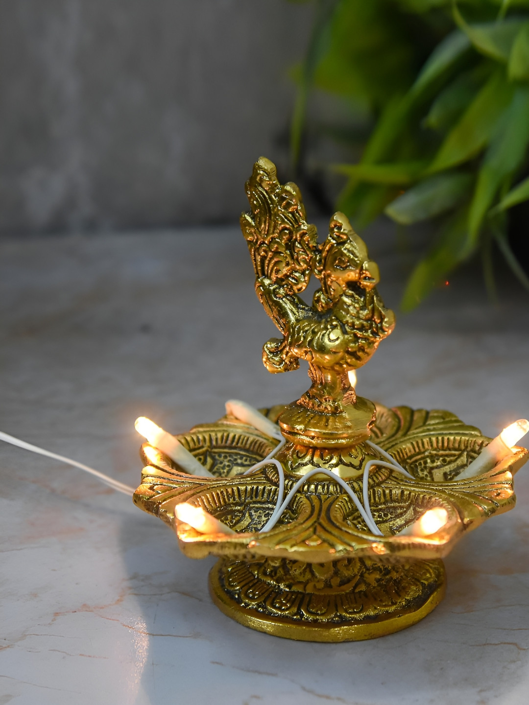 

Bhimonee Decor Gold-Toned Pure Brass Peacock Design LED Light Electric Pooja Diya