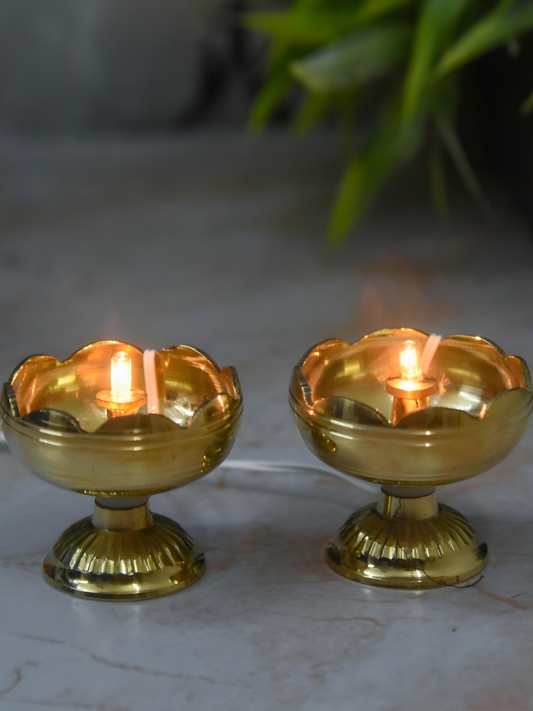 

Bhimonee Decor Gold-Toned 2-Pcs Brass Tamator Nanda Design LED Light Electric Pooja Diyas