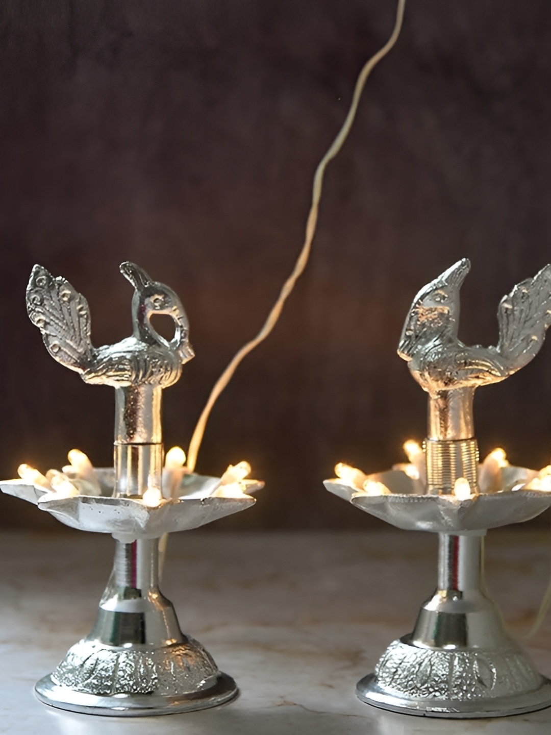 

Bhimonee Decor Silver-Toned 2 Pcs Metal Peacock Electric Diyas
