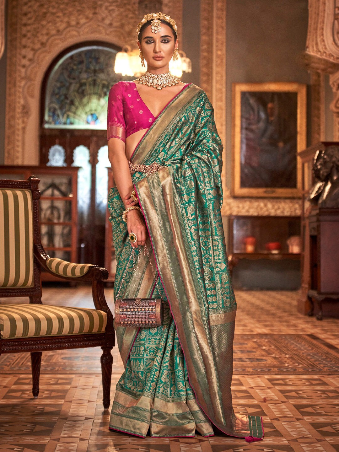 

Mitera Green Ethnic Motifs Woven Design Zari Saree