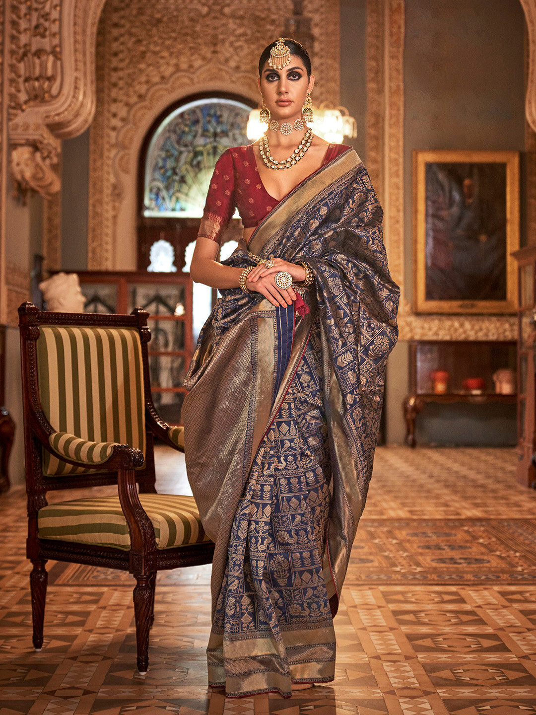 

Mitera Navy Blue & Gold-Toned Ethnic Motif Woven Design Silk Zari Saree