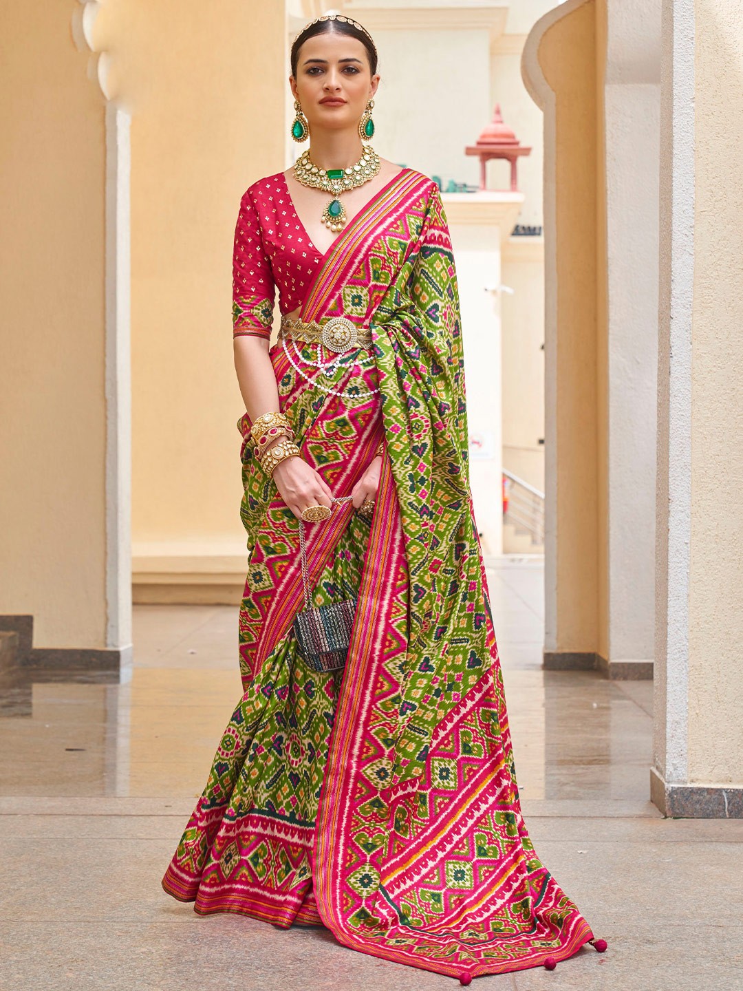 

Mitera Olive Green Ethnic Motif Printed Zari Patola Saree