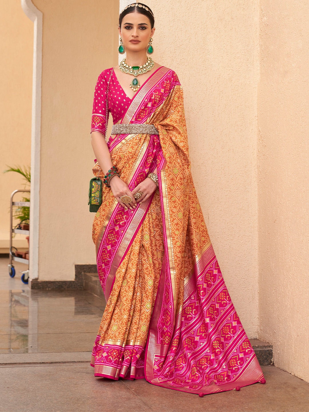 

Mitera Orange Ethnic Motif Printed Zari Patola Saree