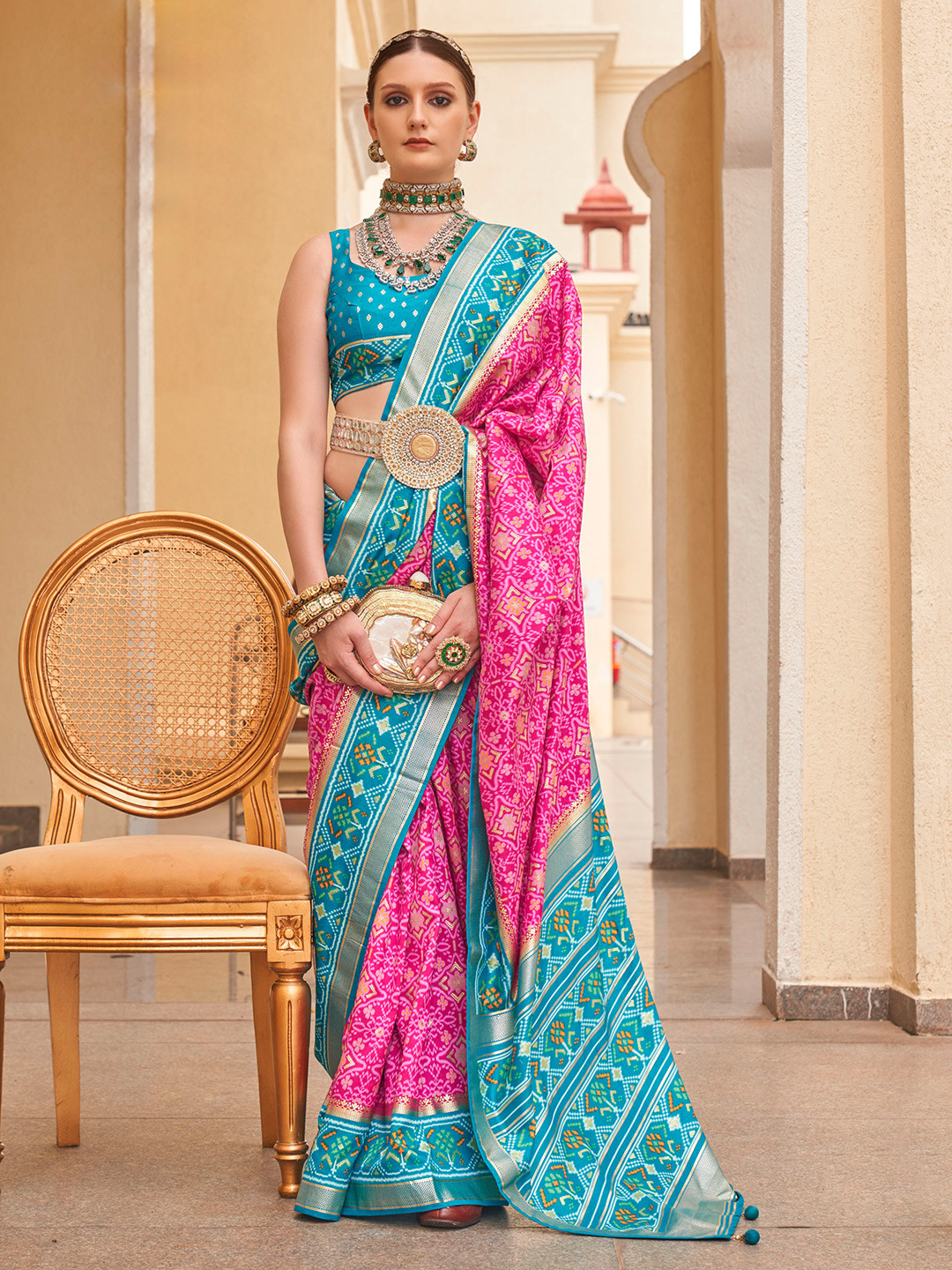 

Mitera Pink & Blue Ethnic Motif Printed Zari Ikkat Silk Patola Saree