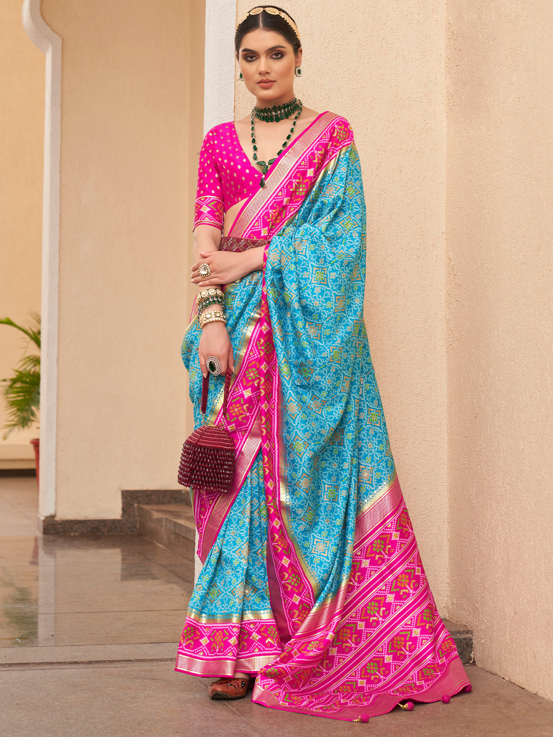 

Mitera Blue & Pink Ethnic Motif Printed Zari Ikkat Silk Patola Saree