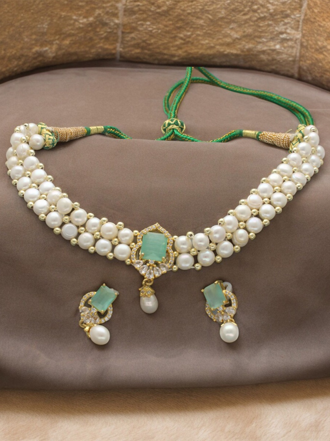

Sri Jagdamba Pearls Dealer Gold-Plated Stone-Studded & Pearl-Beaded Jewellery