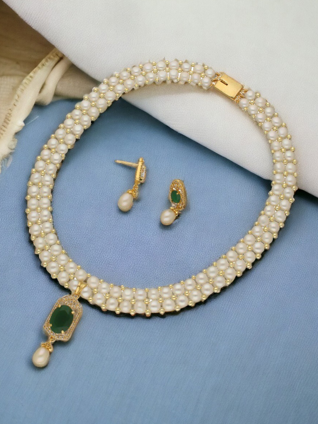 

Sri Jagdamba Pearls Dealer Gold-Plated Stone-Studded & Beaded Jewellery Set