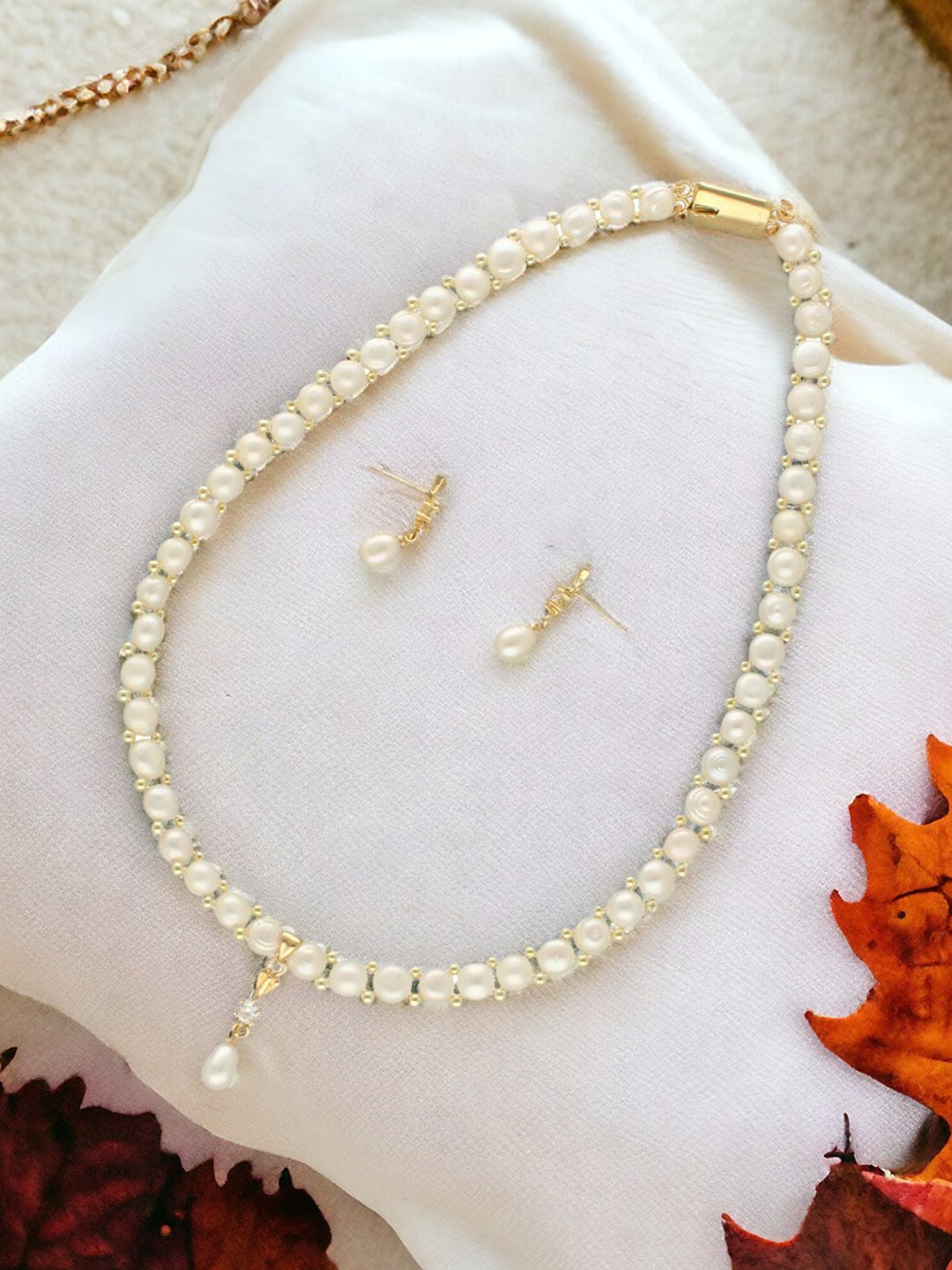

Sri Jagdamba Pearls Dealer Gold-Plated Stone-Studded & Beaded Necklace and Earrings