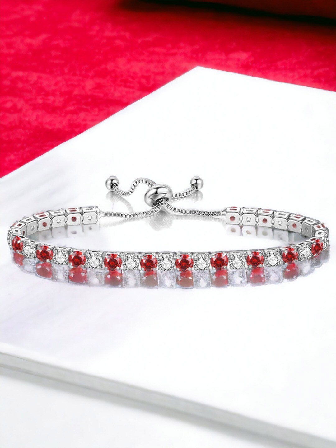 

Jewels Galaxy Silver Plated Round Cut Cubic Zirconia Matrix Tennis Bracelet