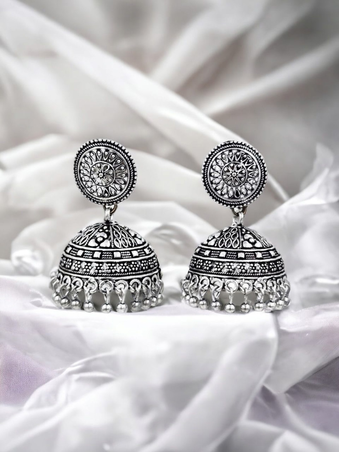 

Sangria Silver Plated Dome Shaped Oxidised Jhumka