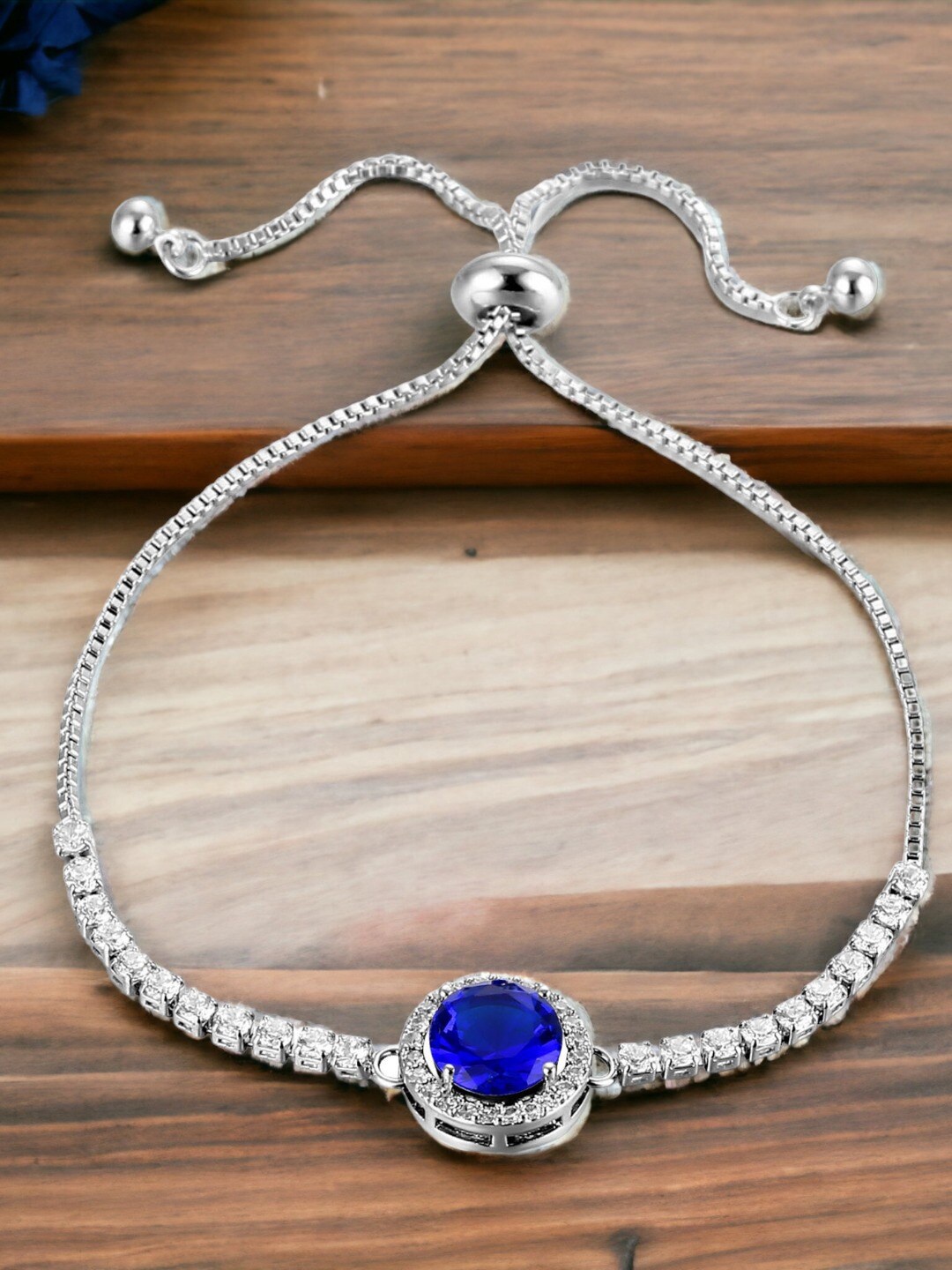

Designs & You Silver Plated Round Crystal Studded Matrix Tennis Bracelet