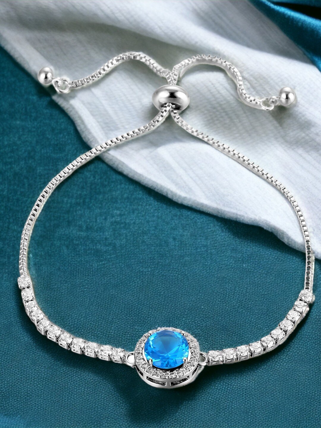 

Designs & You Silver Plated Round Crystal Studded Matrix Tennis Bracelet