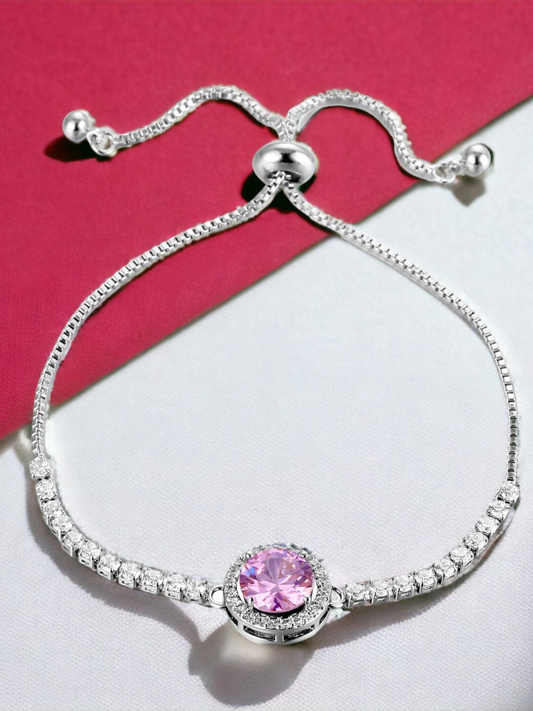 

Designs & You Silver Plated Round Crystal Studded Matrix Tennis Bracelet