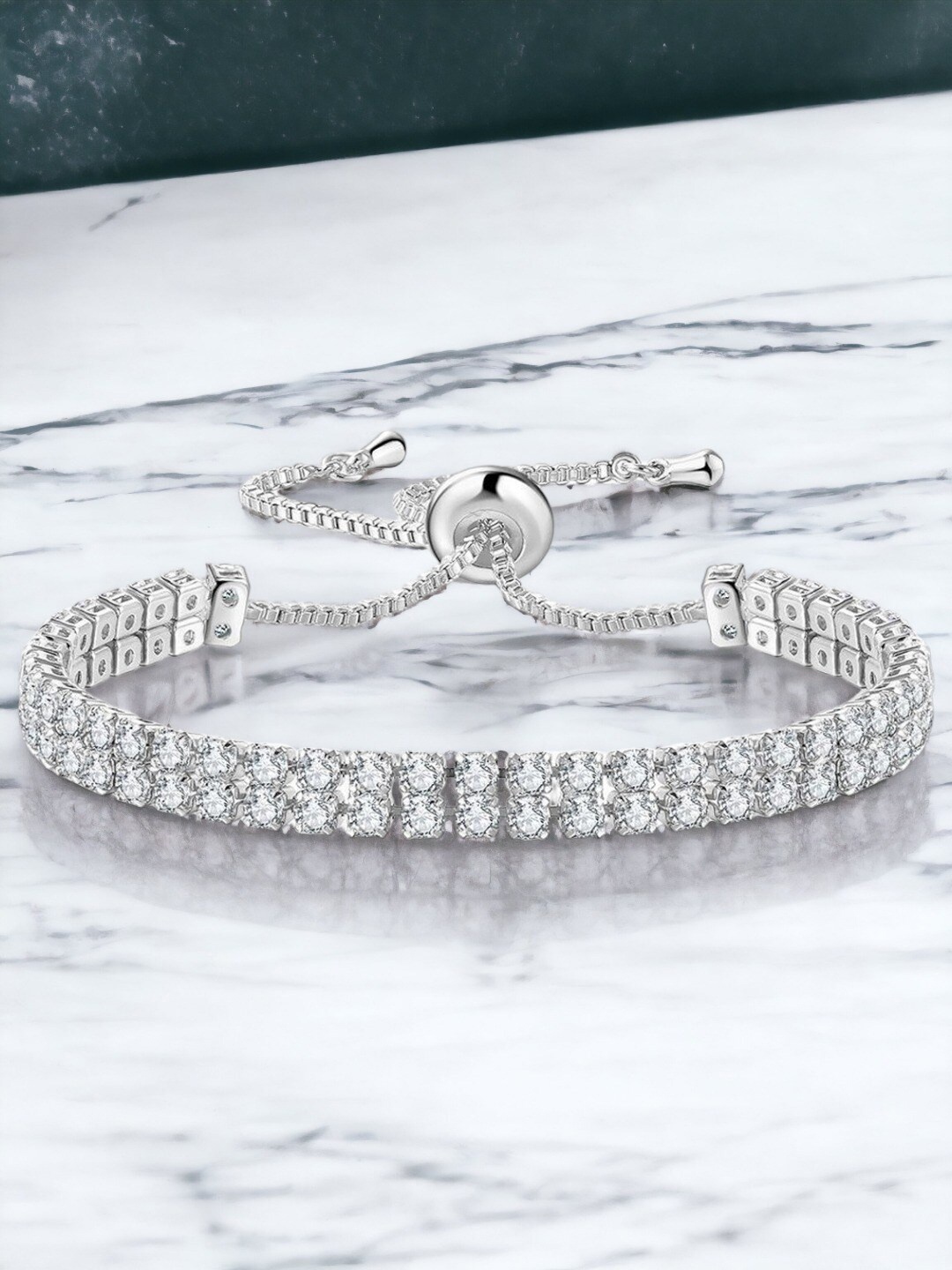 

Designs & You Silver Plated Dual Strand Round Cut Cubic Zirconia Matrix Tennis Bracelet