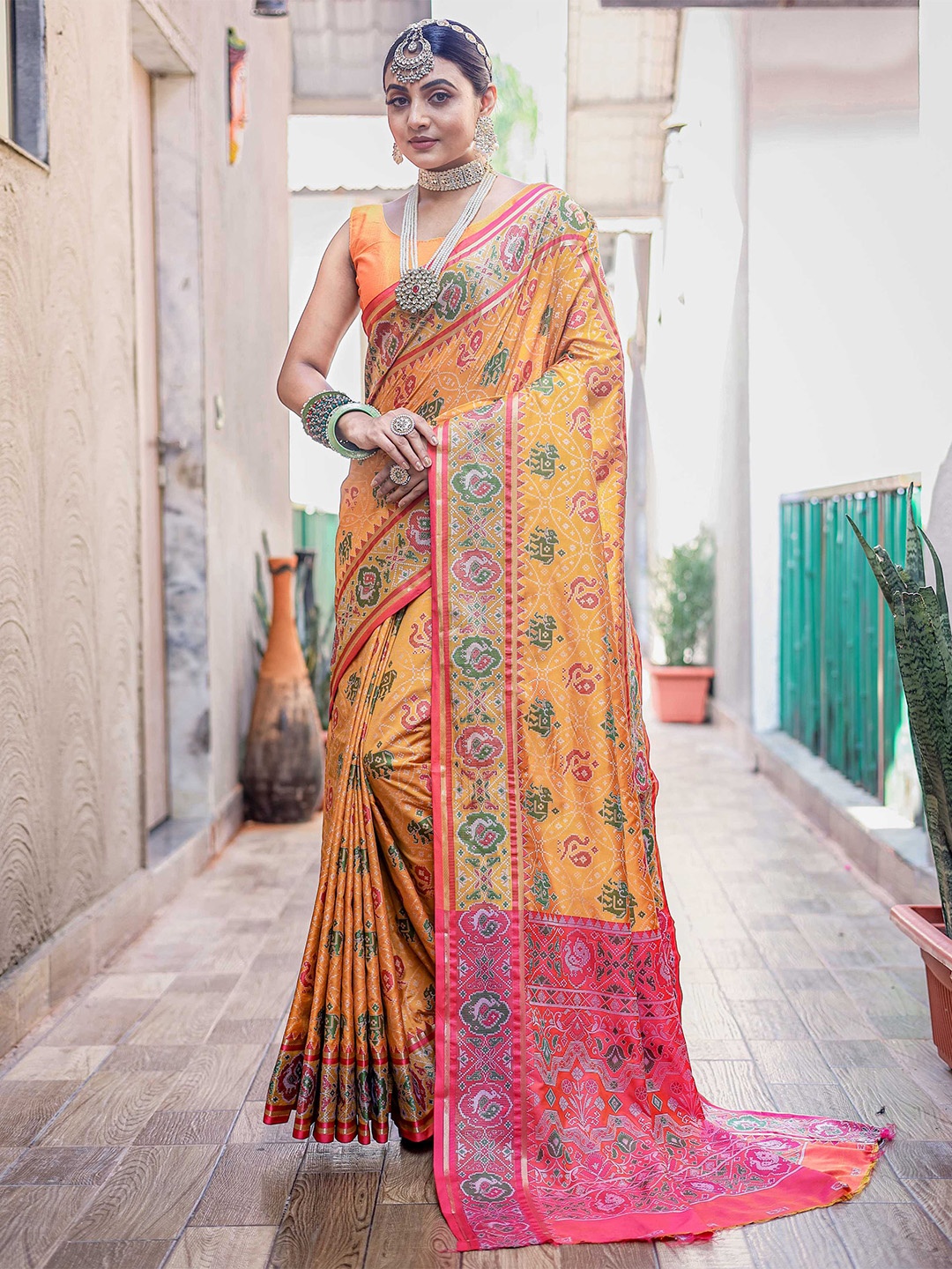 

Mitera Ethnic Motifs Woven Design Zari Patola Saree, Mustard