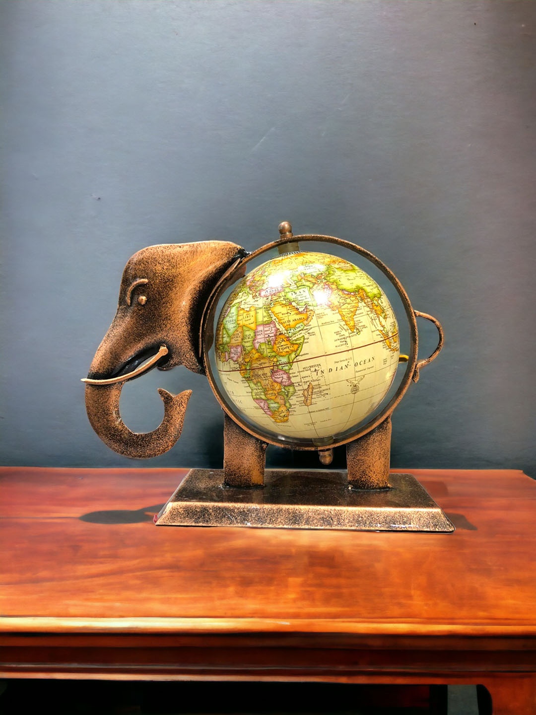 

The Artage Brown & Green Elephant Globe Idol Showpiece