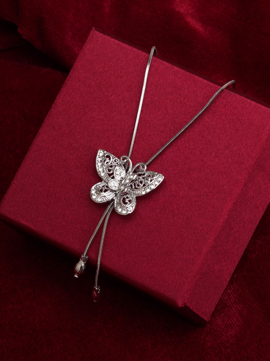 

Mali Fionna Silver Plated Cubic Zirconia Stone Studded Butterfly-Shape Pendant With Chain