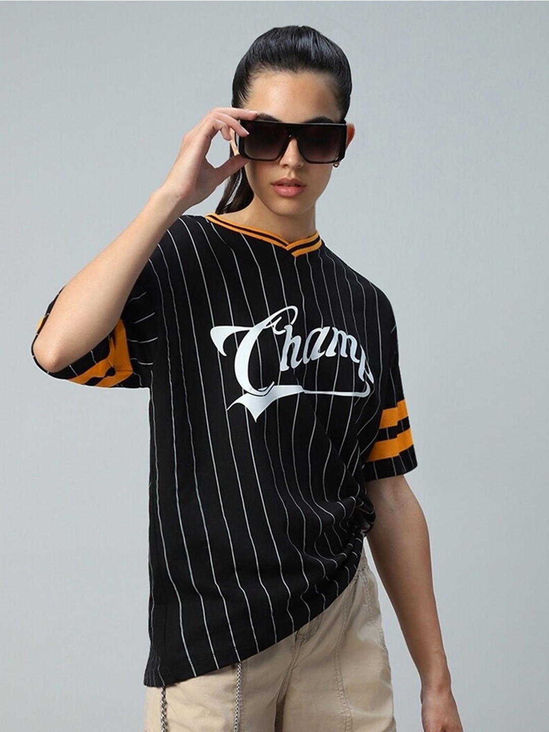 

Bewakoof Heavy Duty 1.0 Women Black Champ Graphic Printed Oversized T-shirt