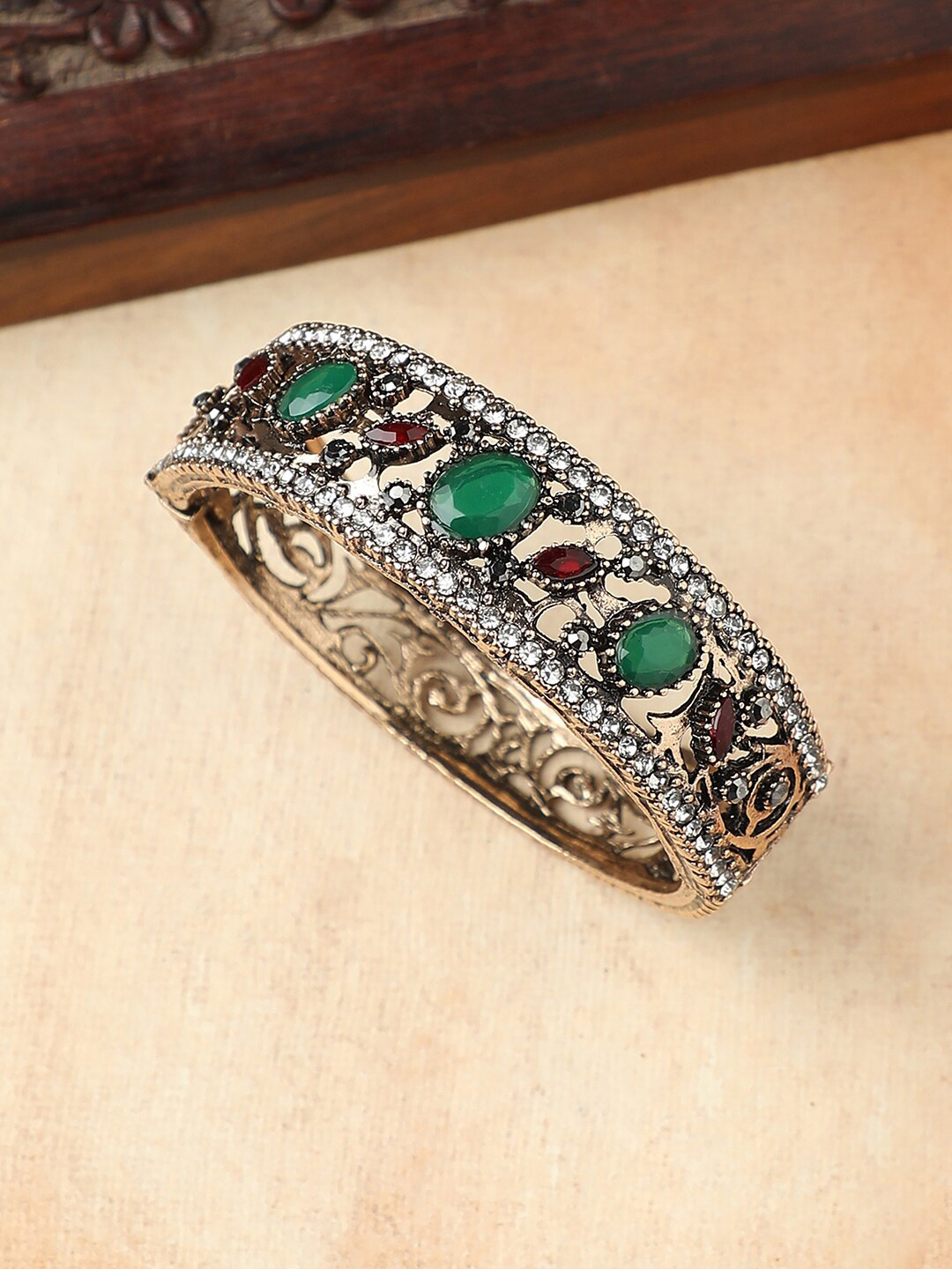 

Anouk Gold-Toned & Green Brass Gold-Plated Artificial Stones Studded Bracelet