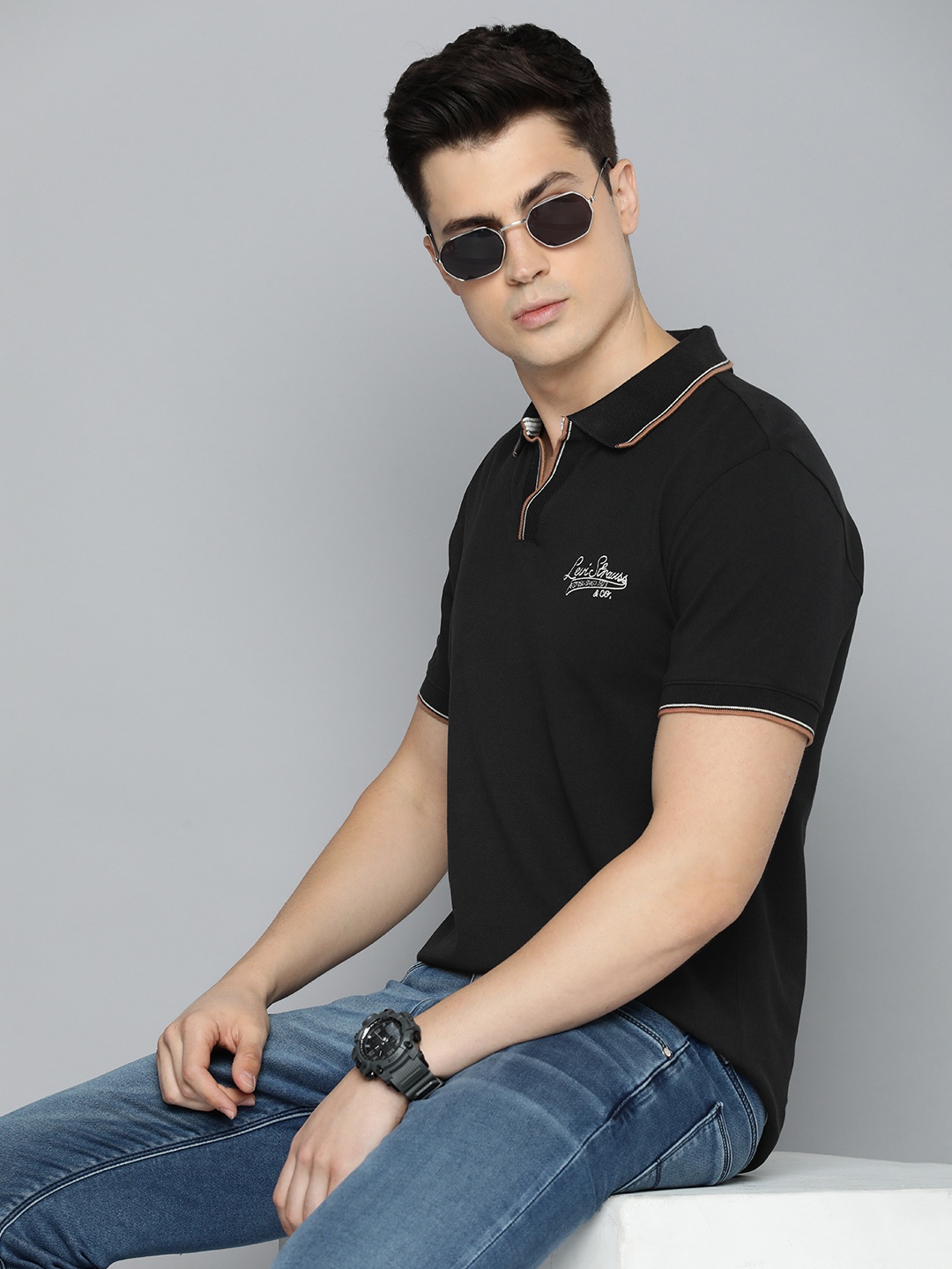 

Levis Men Solid Polo Collar Slim Fit T-shirt With Minimal Brand Logo Embroidered Detail, Black