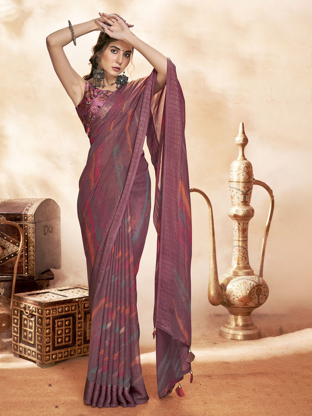 

KALINI Purple Embellished Pure Georgette Designer Saree