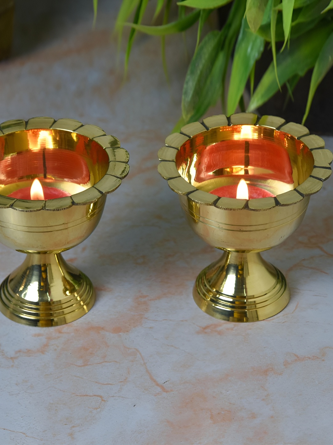 

Bhimonee Decor Gold Toned 2 Pieces Pure Brass Chanda Mukhi Akhand Nanda Diya