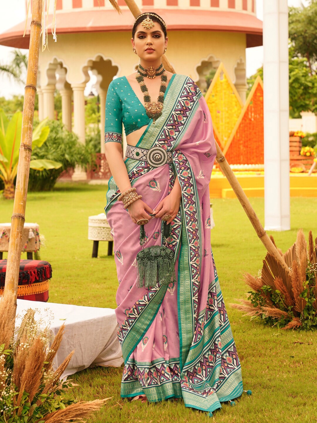 

Anouk Mauve & Blue Ethnic Motifs Woven Designed Zari Patola Saree