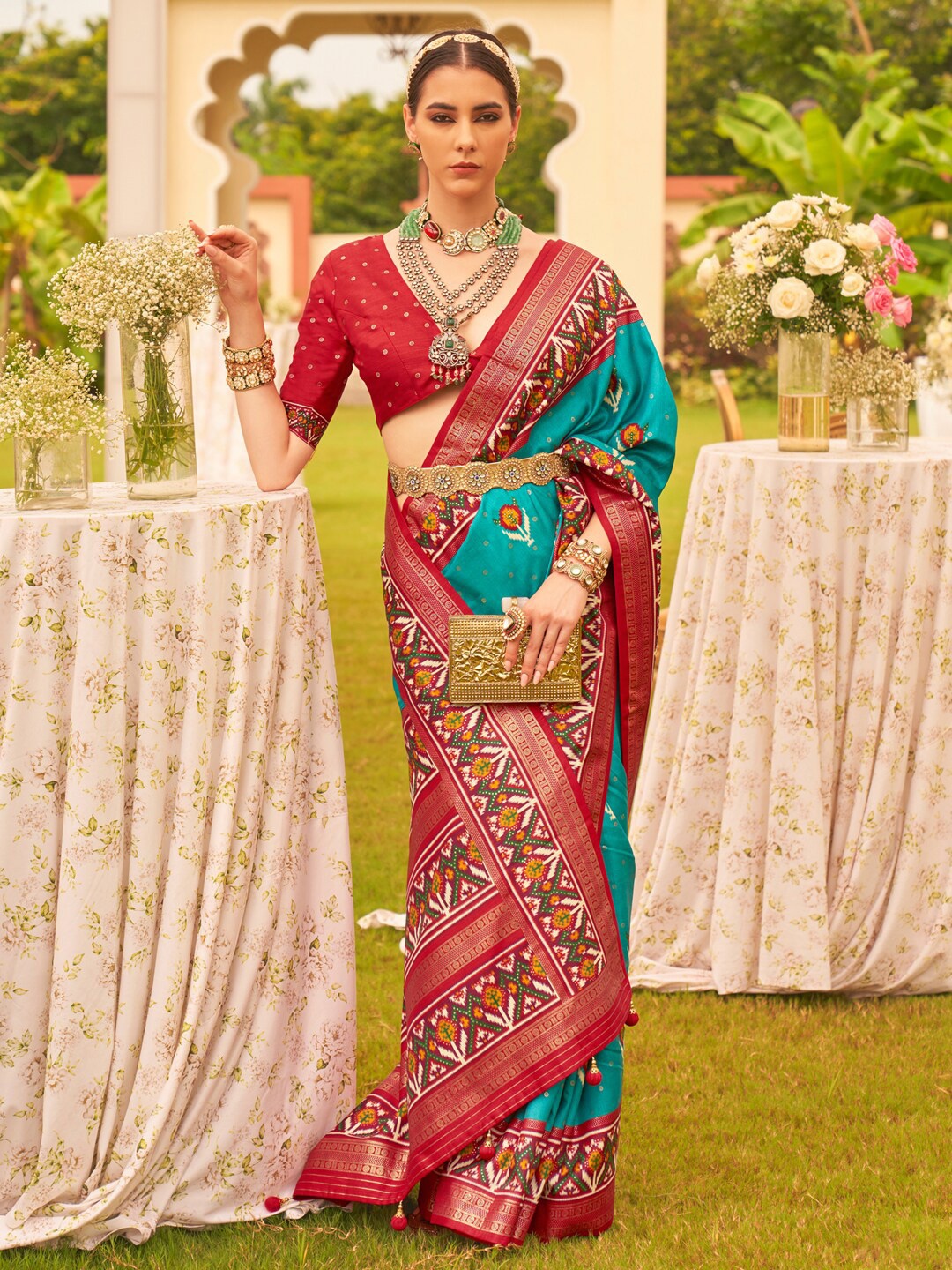 

Anouk Blue & Red Ethnic Motifs Woven Designed Patola Saree