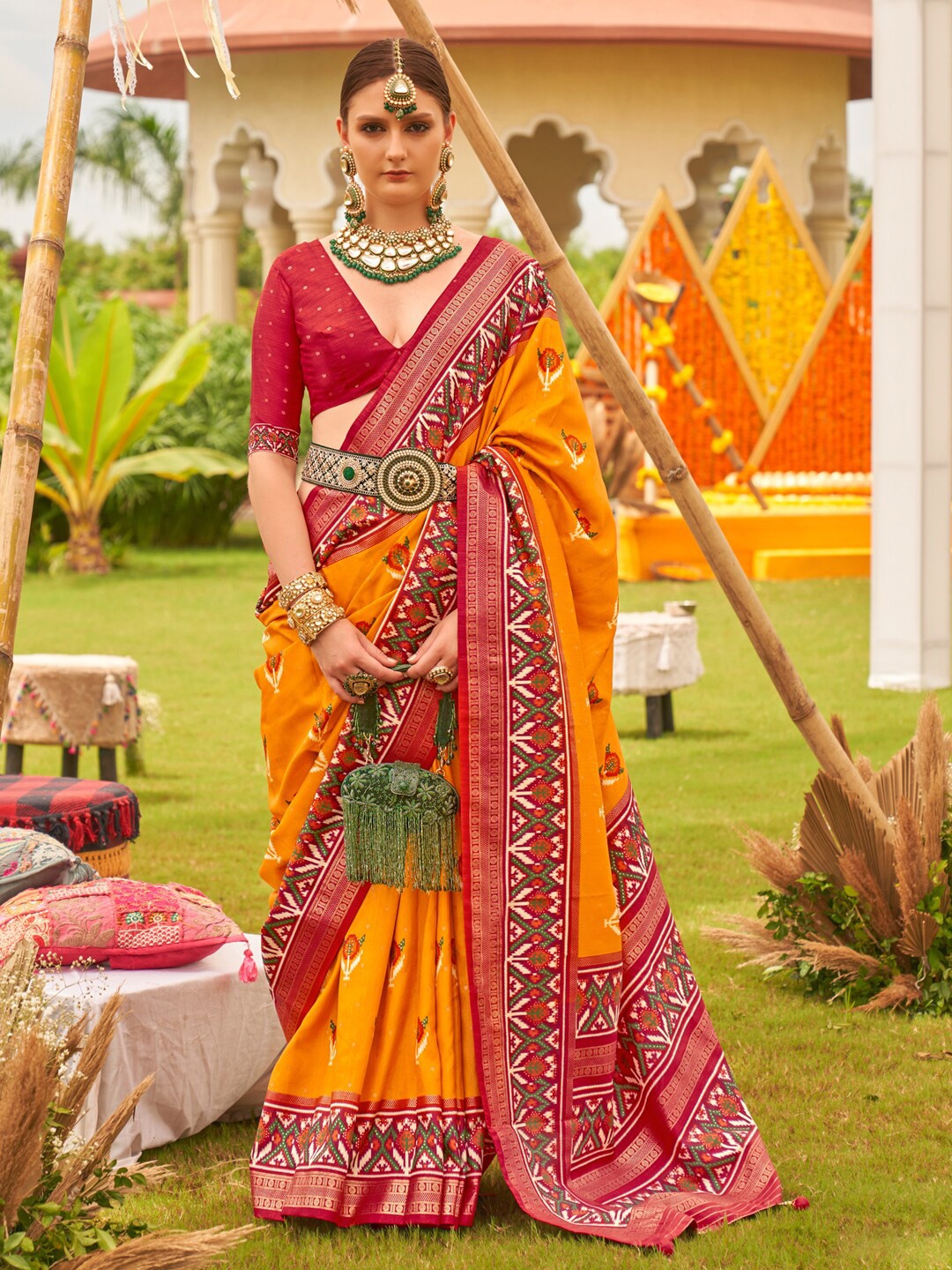 

Anouk Yellow & Red Ethnic Motifs Woven Designed Zari Patola Saree