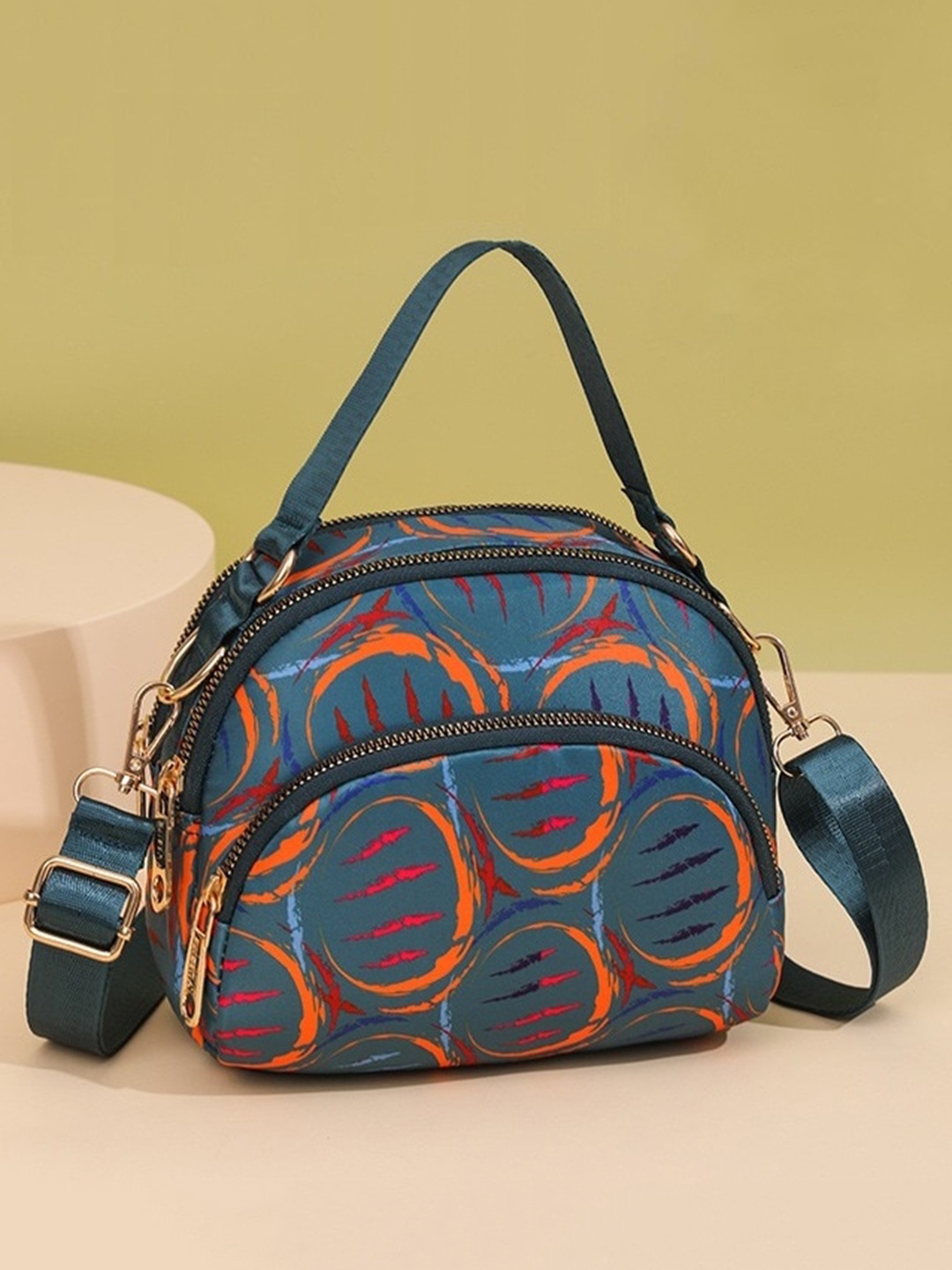 

Diva Dale Abstract Printed Structured Multi-Pockets Sling Bag, Teal