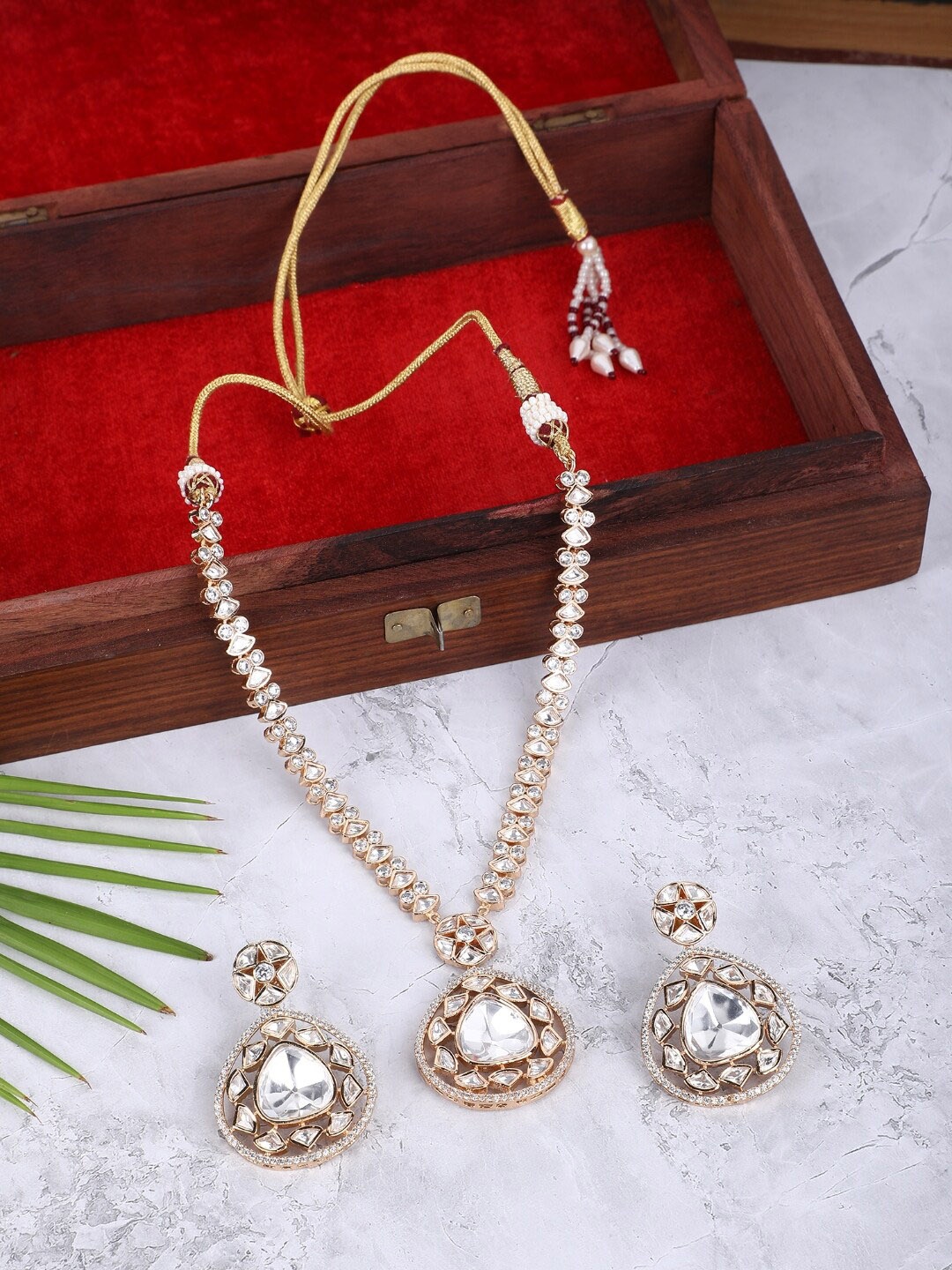 

AURAA TRENDS Gold-Plated American Diamond Studded Jewellery Set