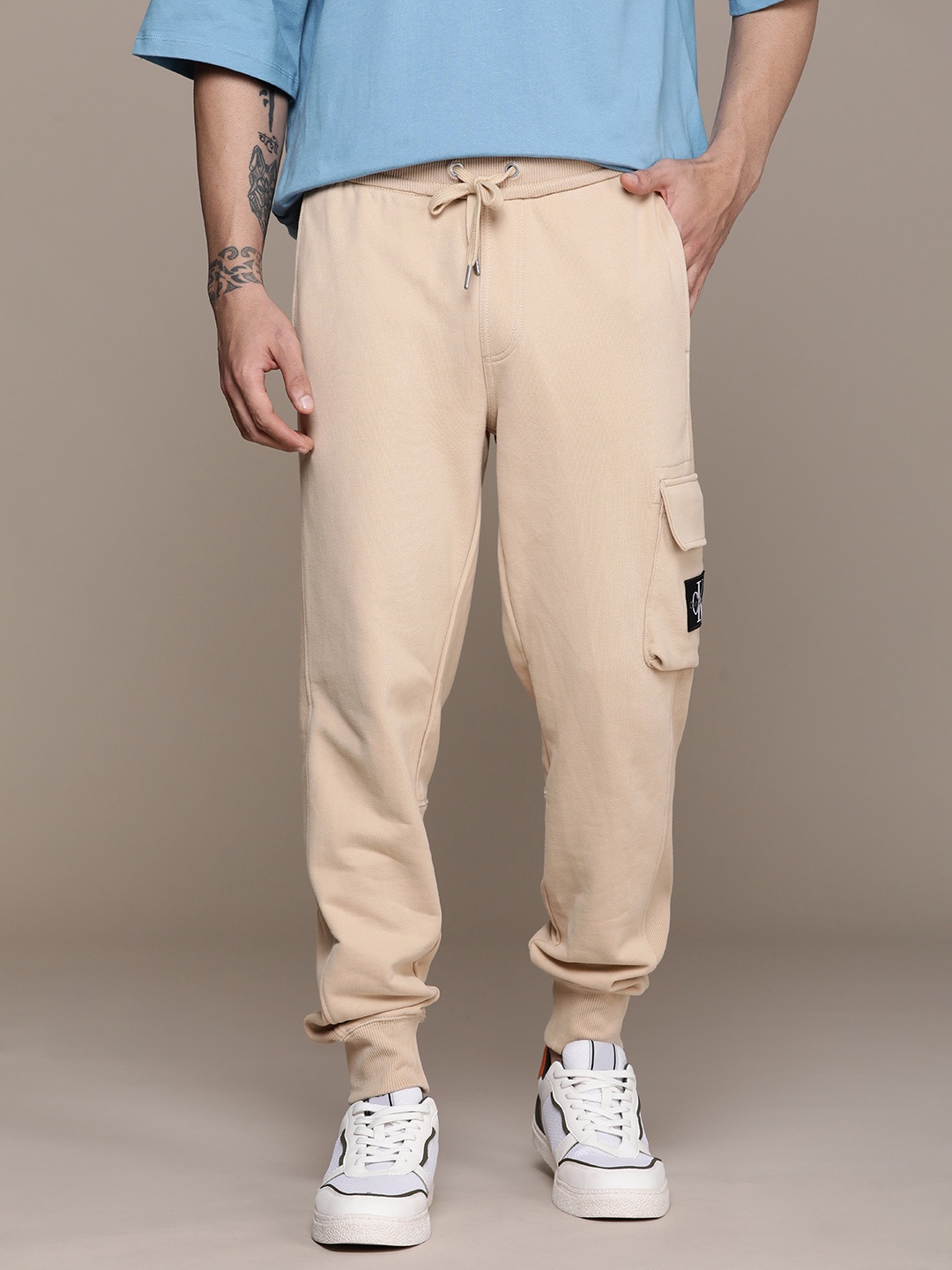 

Calvin Klein Jeans Men Pure Cotton Mid-Rise Joggers, Beige