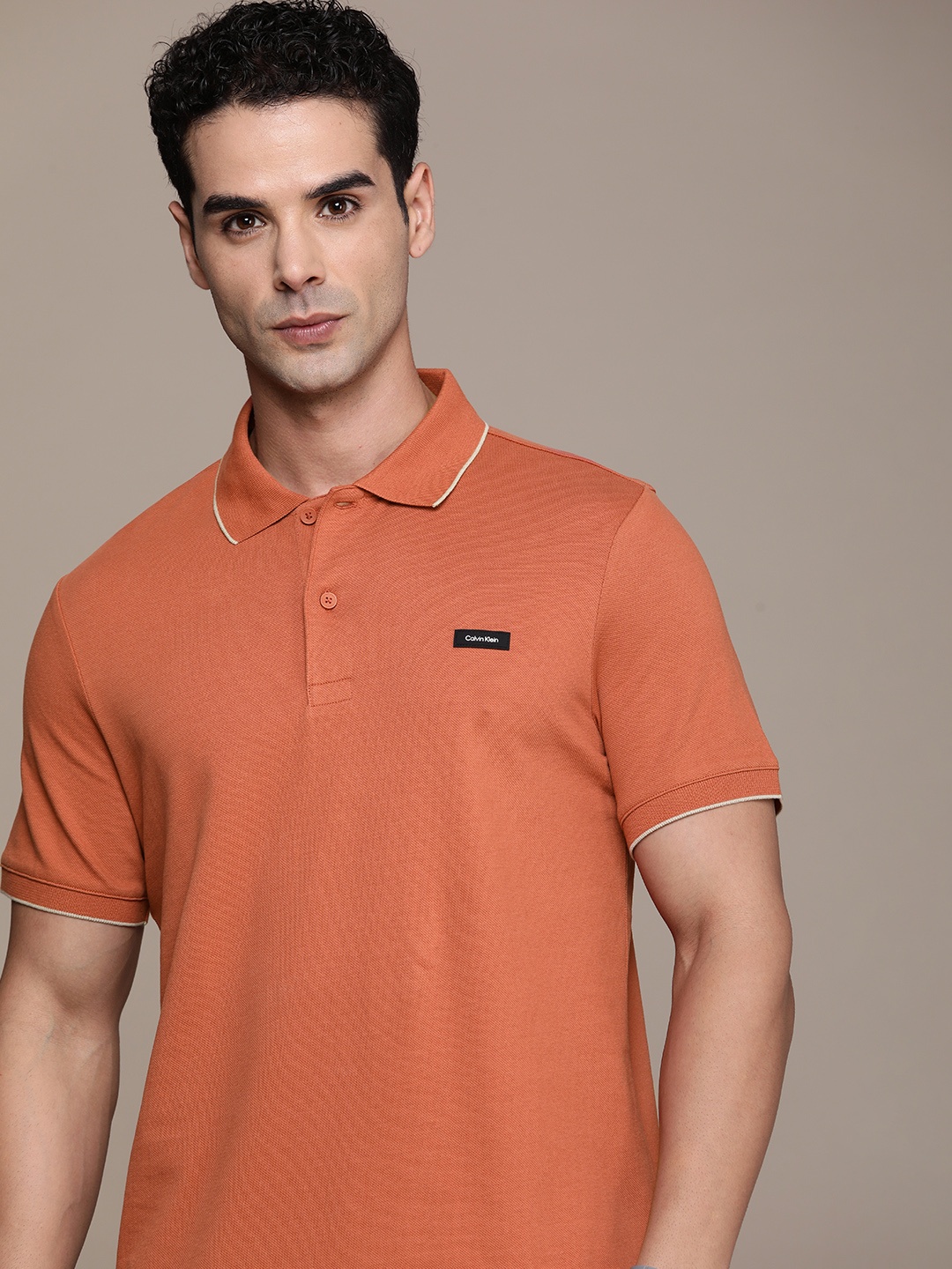 

Calvin Klein Jeans Solid Polo Collar Slim Fit T-shirt, Rust