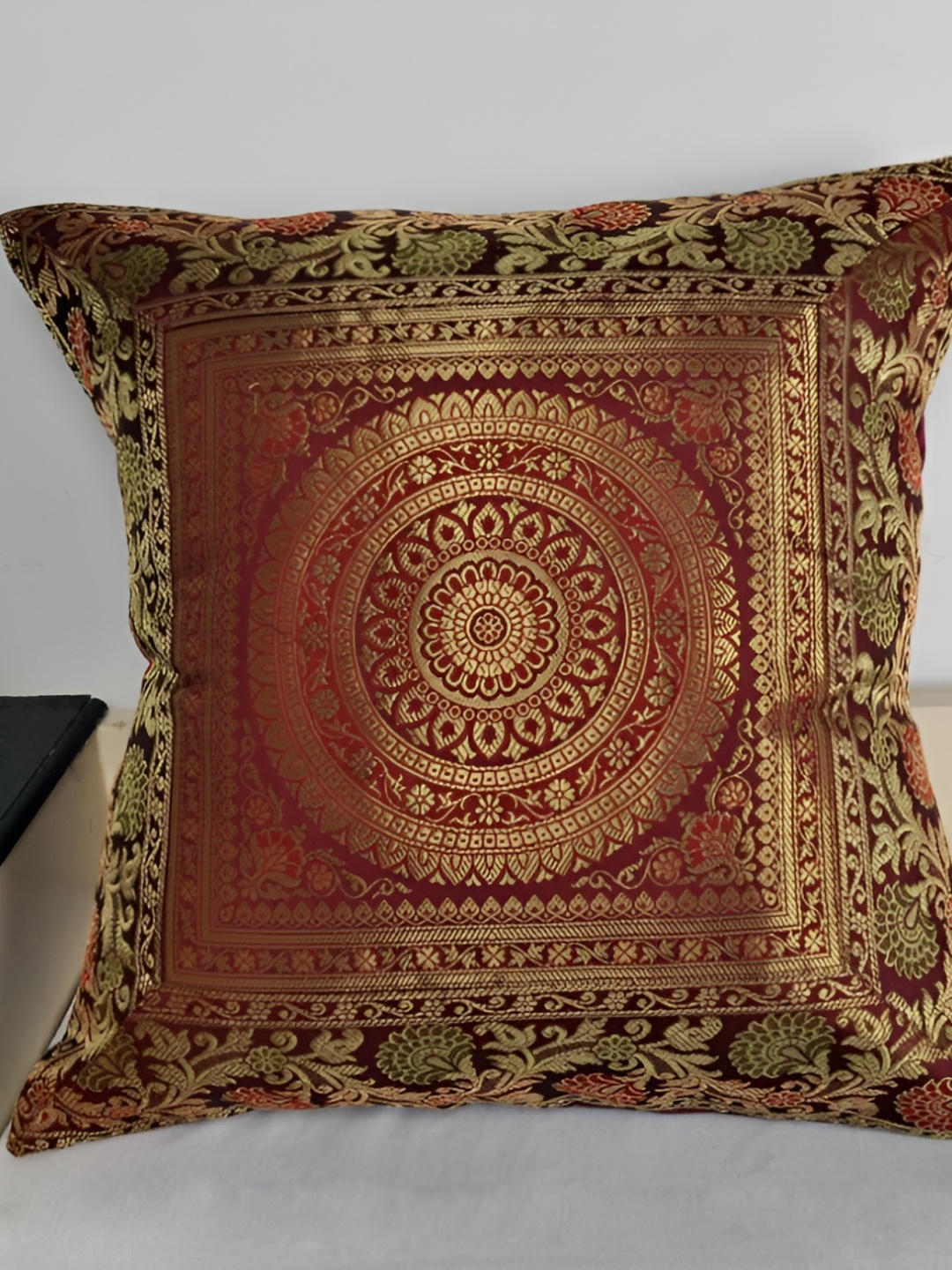 

Lal Haveli Maroon & Gold Toned Ethnic Motif Silk Square Cushion Cover