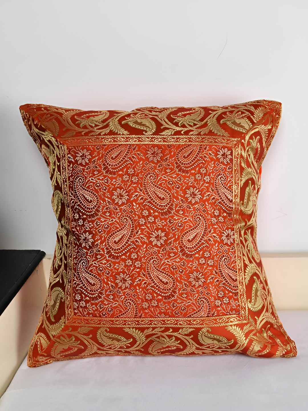 

Lal Haveli Orange & Gold Toned Ethnic Motif Silk Square Cushion Cover
