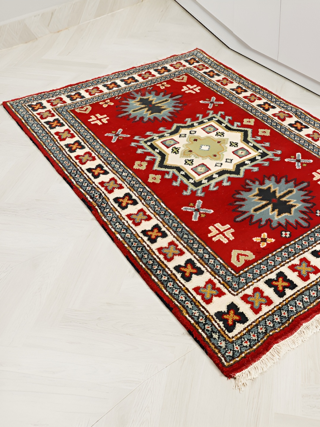 

MIRZAPUR KALEEN AND RUGS Red & Black Handmade Woollen Carpet