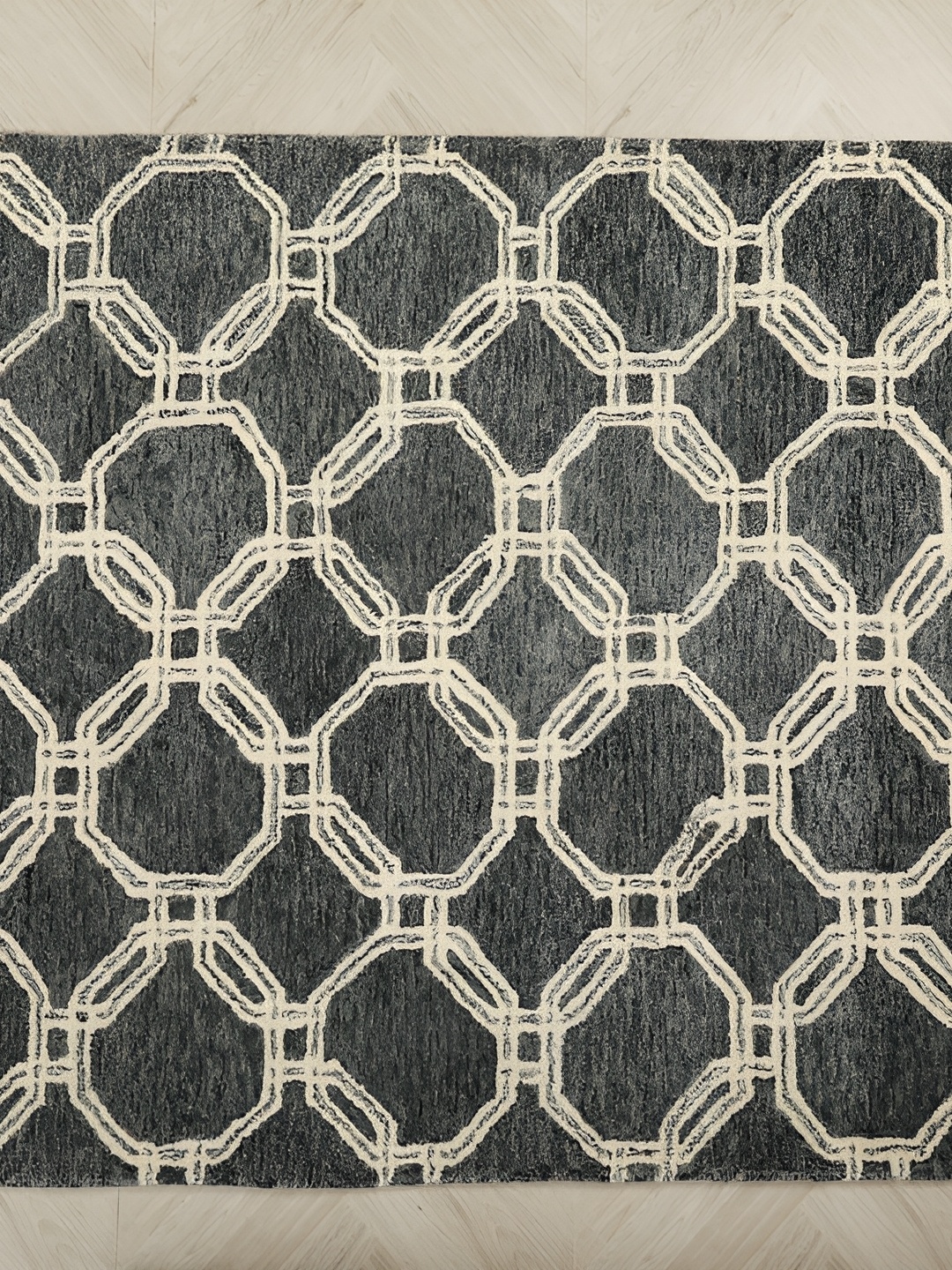 

MIRZAPUR KALEEN AND RUGS Black & Beige Handmade Woollen Carpet