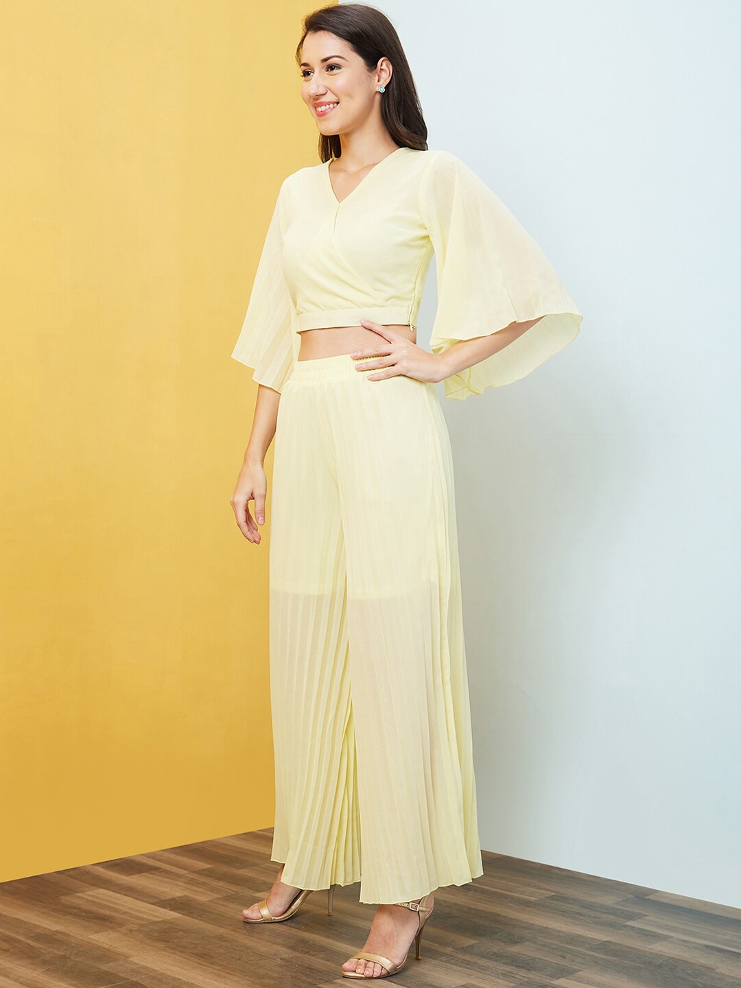 

Globus Women Yellow Solid V-Neck Co-Ord Set With Top & Palazzo